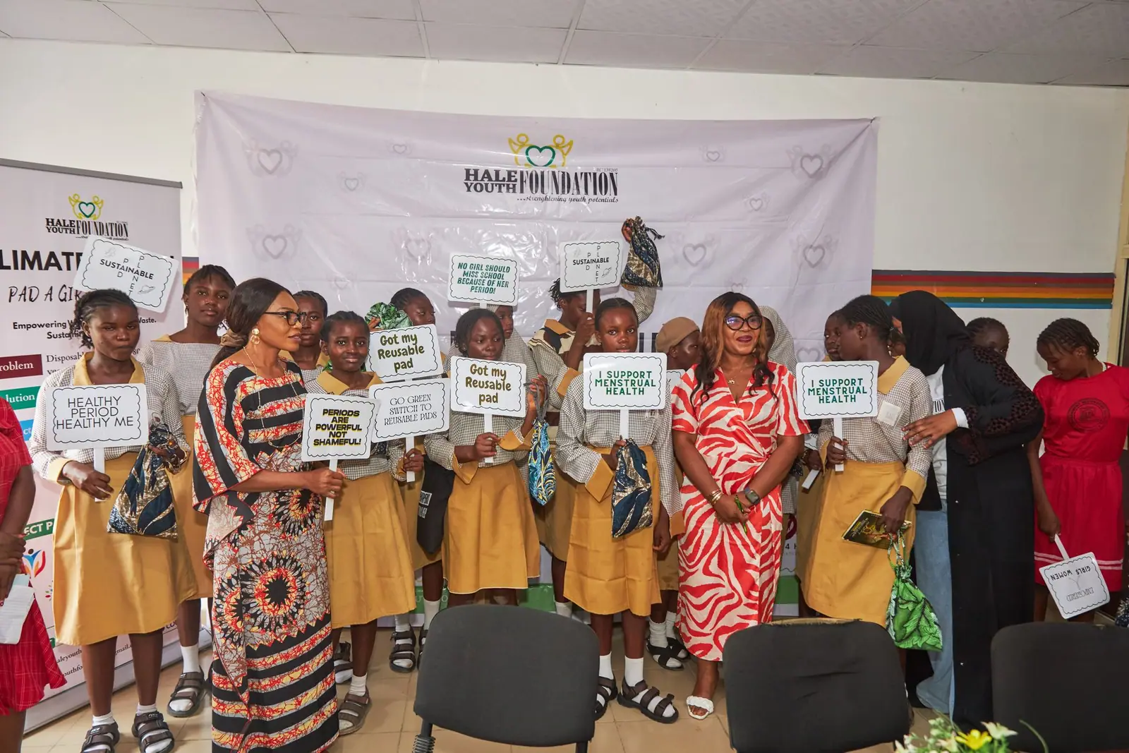 Pad-a-Girl event at Jabi — girls holding advocacy placards